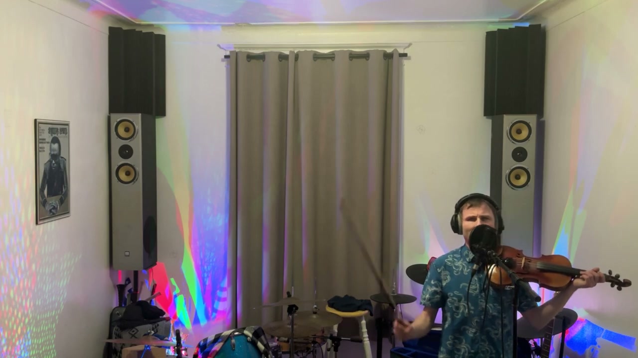Devin singing and playing fiddle during the Thunder live performance.
